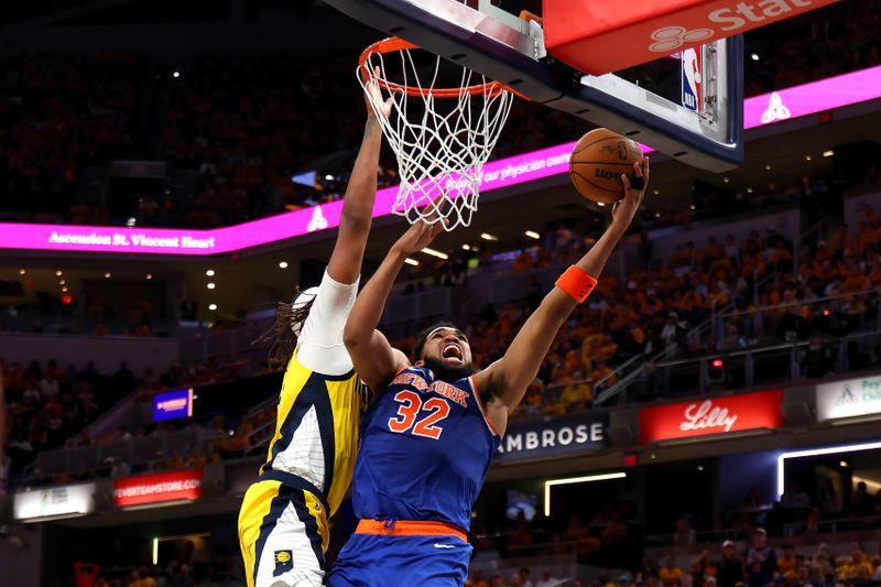 INDIANAPOLIS, INDIANA - MAY 25: Karl-Anthony Towns #32 of the New York Knicks drives to the basket against Myles Turner #33 of the Indiana Pacers during the fourth quarter in Game Three of the Eastern Conference Finals of the 2025 NBA Playoffs at Gainbridge Fieldhouse on May 25, 2025 in Indianapolis, Indiana. NOTE TO USER: User expressly acknowledges and agrees that, by downloading and or using this photograph, User is consenting to the terms and conditions of the Getty Images License Agreement. (Photo by Gregory Shamus/Getty Images)