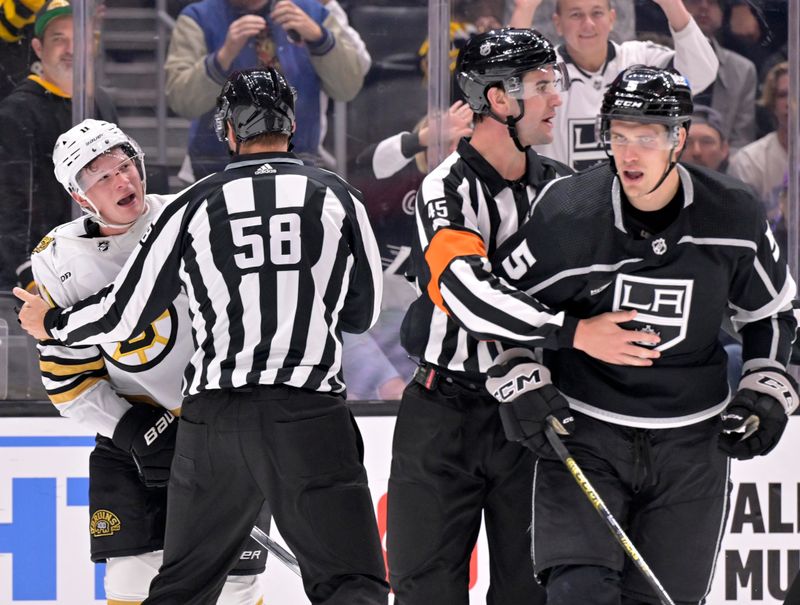 Oct 21, 2023; Los Angeles, California, USA; Boston Bruins center Trent Frederic (11) yells out at Los Angeles Kings defenseman Andreas Englund (5) during the third period at Crypto.com Arena. Mandatory Credit: Alex Gallardo-USA TODAY Sports