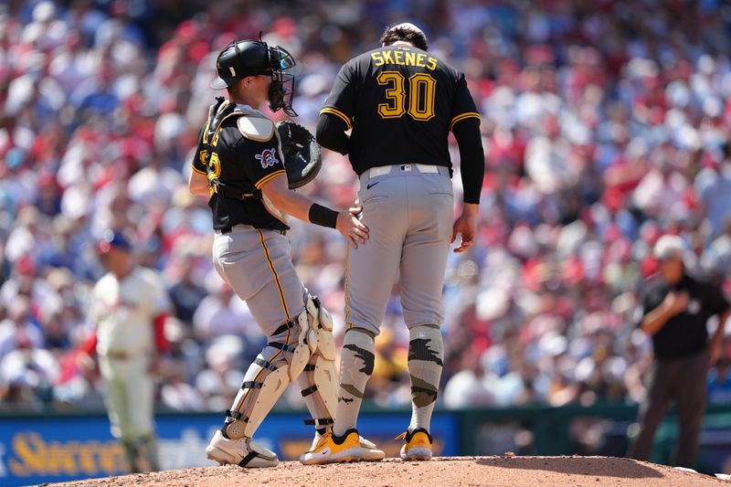 May 18, 2025; Philadelphia, Pennsylvania, USA; Pittsburgh Pirates catcher Henry Davis (32) meets with starting pitcher Paul Skenes (30) against the Philadelphia Phillies in the sixth inning at Citizens Bank Park. Mandatory Credit: Kyle Ross-Imagn Images