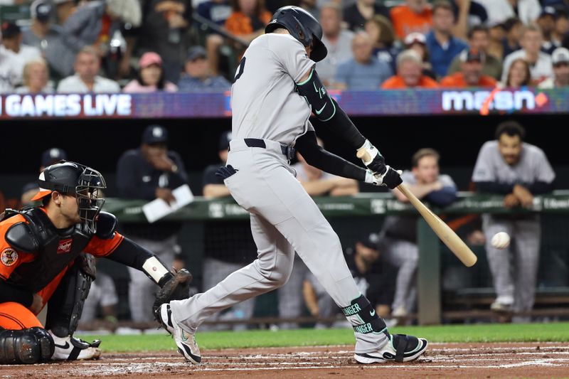 Sep 20, 2025; Baltimore, Maryland, USA; during the New York Yankees outfielder Cody Bellinger (35) hits a single during the first inning against the Baltimore Orioles at Oriole Park at Camden Yards. Mandatory Credit: Daniel Kucin Jr.-Imagn Images