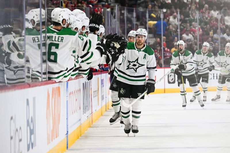 Oct 22, 2022; Montreal, Quebec, CAN; Dallas Stars center Joe Pavelski (16) celebrates with teammates at the bench after scoring a goal against the Montreal Canadiens during the first period at Bell Centre. Mandatory Credit: David Kirouac-USA TODAY Sports