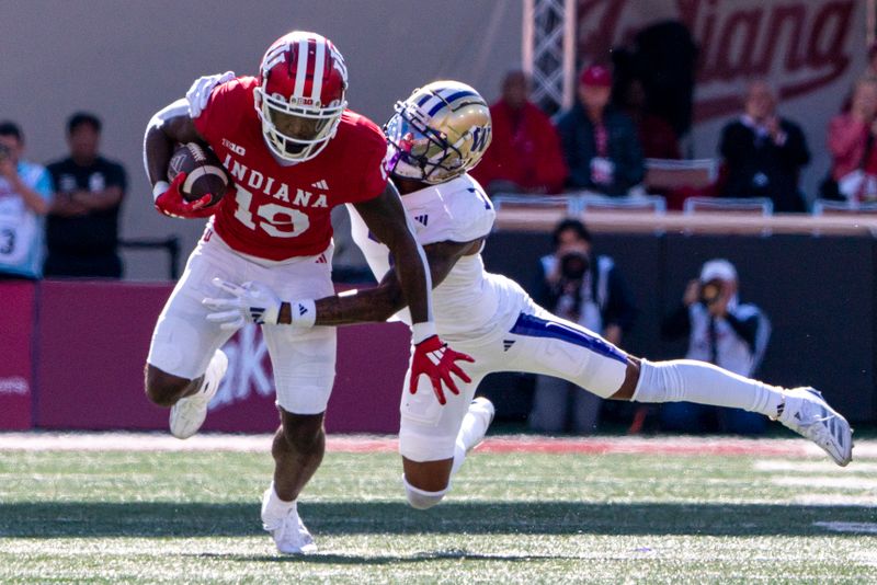 Oct 26, 2024; Bloomington, Indiana, USA; Indiana Hoosiers wide receiver Miles Cross (19) is tackled by Washington Huskies cornerback Ephesians Prysock (7) during the second quarter at Memorial Stadium. Mandatory Credit: Jacob Musselman-Imagn Images