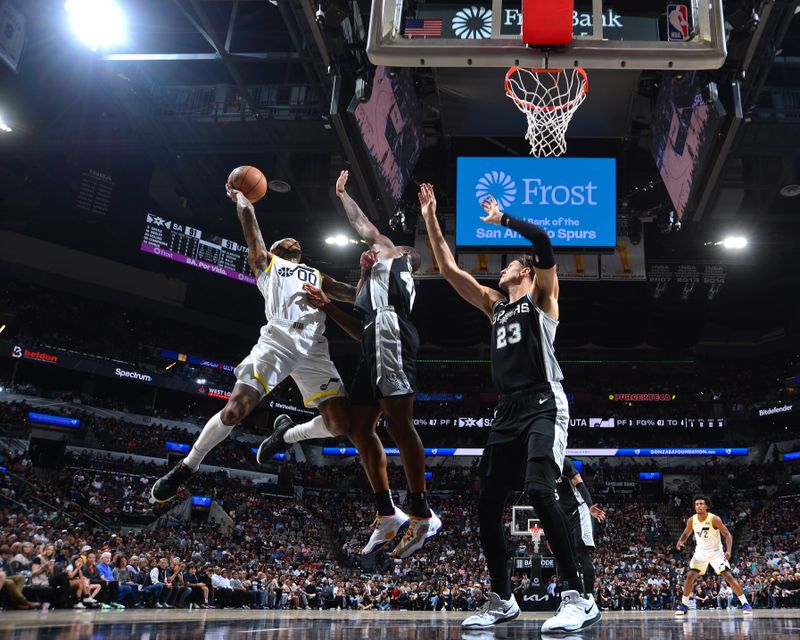 SAN ANTONIO, TX - NOVEMBER 9: Jordan Clarkson #00 of the Utah Jazz drives to the basket during the game against the San Antonio Spurs on November 9, 2024 at the Frost Bank Center in San Antonio, Texas. NOTE TO USER: User expressly acknowledges and agrees that, by downloading and or using this photograph, user is consenting to the terms and conditions of the Getty Images License Agreement. Mandatory Copyright Notice: Copyright 2024 NBAE (Photos by Michael Gonzales/NBAE via Getty Images)