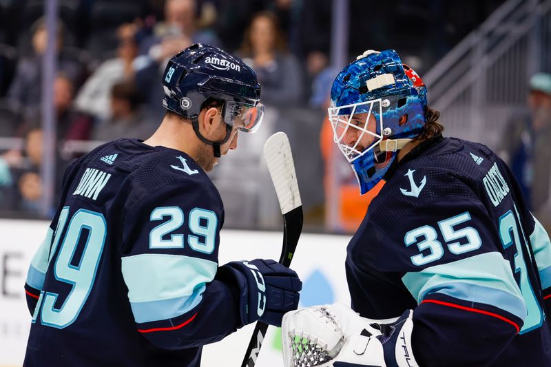 Jan 4, 2024; Seattle, Washington, USA; Seattle Kraken defenseman Vince Dunn (29) celebrate following a 4-1 victory against the Ottawa Senators at Climate Pledge Arena. Mandatory Credit: Joe Nicholson-USA TODAY Sports