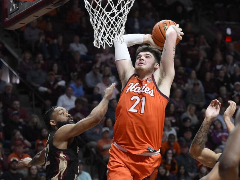 Mar 4, 2023; Blacksburg, Virginia, USA; Virginia Tech Hokies forward Grant Basile (21) drives to the basket against the Florida State Seminoles in the second half at Cassell Coliseum. Mandatory Credit: Lee Luther Jr.-USA TODAY Sports