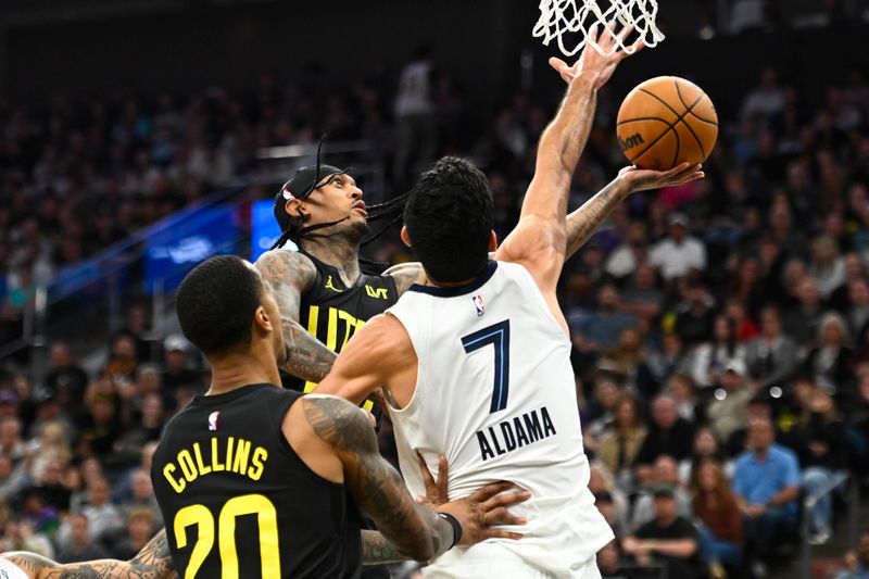 SALT LAKE CITY, UTAH - OCTOBER 23: Jordan Clarkson #00 of the Utah Jazz drives to the basket against Santi Aldama #7 of the Memphis Grizzlies during the first quarter at Delta Center on October 23, 2024 in Salt Lake City, Utah. NOTE TO USER: User expressly acknowledges and agrees that, by downloading and or using this photograph, User is consenting to the terms and conditions of the Getty Images License Agreement. (Photo by Alex Goodlett/Getty Images)