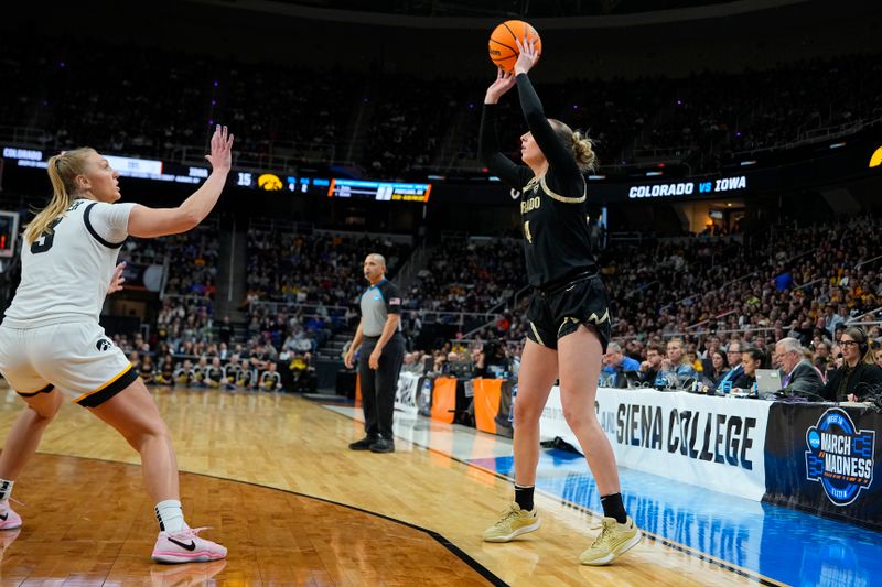 Mar 30, 2024; Albany, NY, USA; Colorado Buffaloes guard Sara-Rose Smith (4) shoots the ball against Iowa Hawkeyes guard Sydney Affolter (3) during the first half in the semifinals of the Albany Regional of the 2024 NCAA Tournament at MVP Arena. Mandatory Credit: Gregory Fisher-USA TODAY Sports