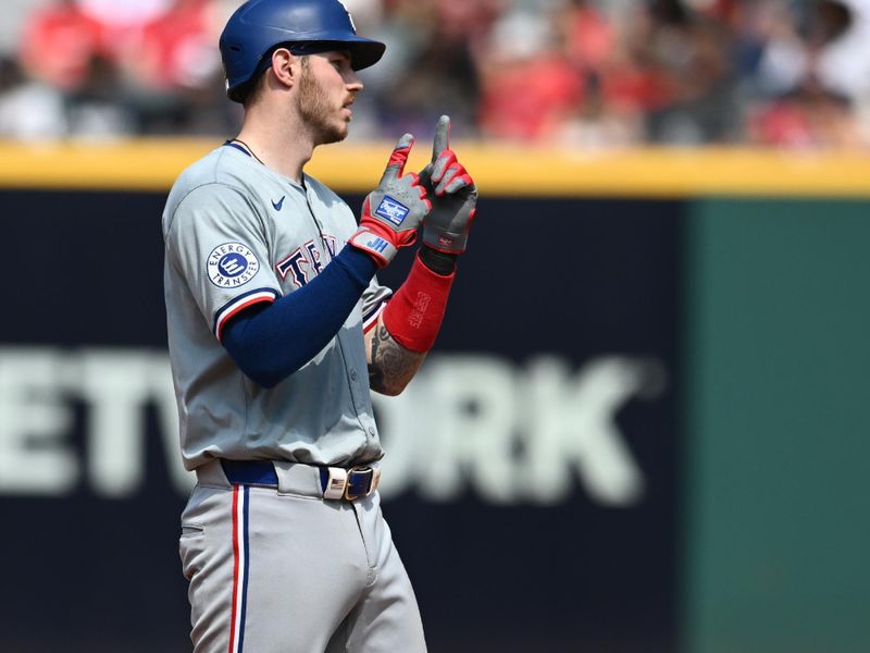 Aug 25, 2024; Cleveland, Ohio, USA; Texas Rangers catcher Jonah Heim (28) celebrates after hitting an RBI double during the fifth inning against the Cleveland Guardians at Progressive Field. Mandatory Credit: Ken Blaze-USA TODAY Sports