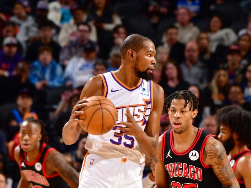 PHOENIX, AZ - JANUARY 22: Kevin Durant #35 of the Phoenix Suns looks to pass the ball during the game against the Chicago Bulls on January 22, 2024 at Footprint Center in Phoenix, Arizona. NOTE TO USER: User expressly acknowledges and agrees that, by downloading and or using this photograph, user is consenting to the terms and conditions of the Getty Images License Agreement. Mandatory Copyright Notice: Copyright 2024 NBAE (Photo by Barry Gossage/NBAE via Getty Images)