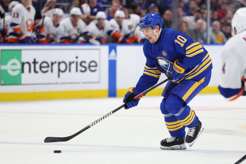 Mar 14, 2024; Buffalo, New York, USA;  Buffalo Sabres defenseman Henri Jokiharju (10) takes a shot on goal during the second period against the New York Islanders at KeyBank Center. Mandatory Credit: Timothy T. Ludwig-USA TODAY Sports