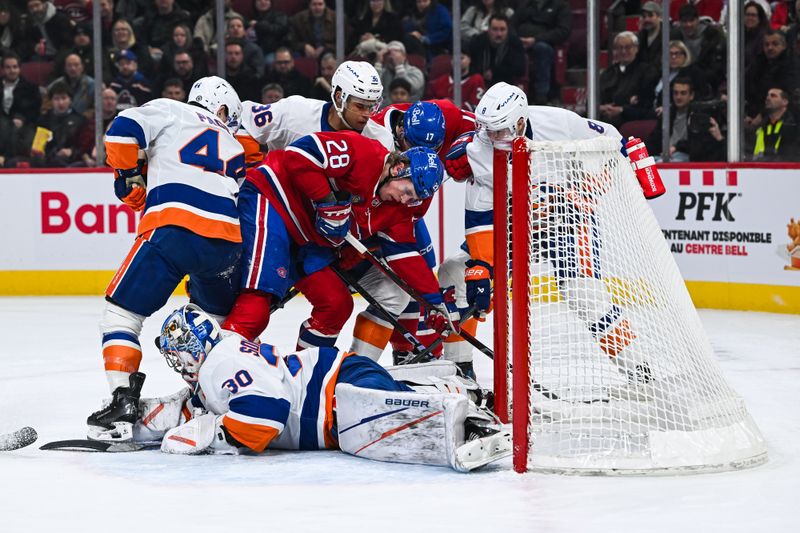 Dec 3, 2024; Montreal, Quebec, CAN; New York Islanders goalie Ilya Sorokin (30) makes a save against Montreal Canadiens center Christian Dvorak (28) during the first period at Bell Centre. Mandatory Credit: David Kirouac-Imagn Images