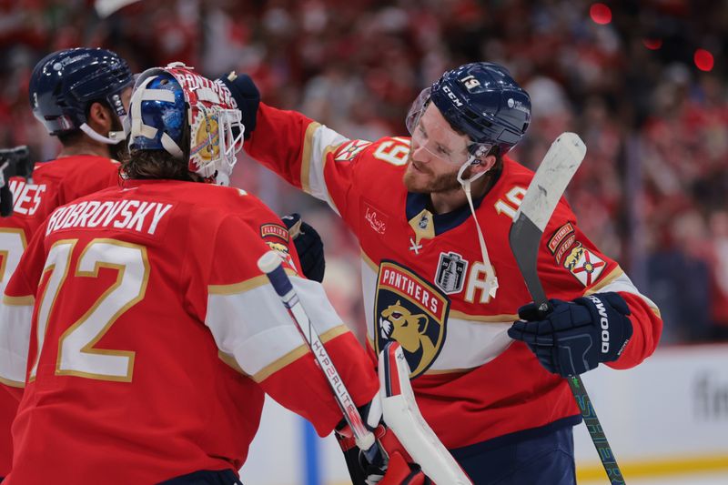 Jun 9, 2025; Sunrise, Florida, USA; Florida Panthers forward Matthew Tkachuk (19) celebrates with goaltender Sergei Bobrovsky (72) after the third period in game three of the 2025 Stanley Cup Final at Amerant Bank Arena. Mandatory Credit: Sam Navarro-Imagn Images