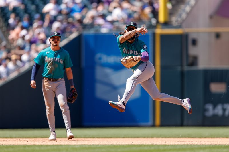 Apr 21, 2024; Denver, Colorado, USA; Seattle Mariners shortstop J.P. Crawford (3) makes a throw to first for an out in the fourth inning against the Colorado Rockies at Coors Field. Mandatory Credit: Isaiah J. Downing-USA TODAY Sports