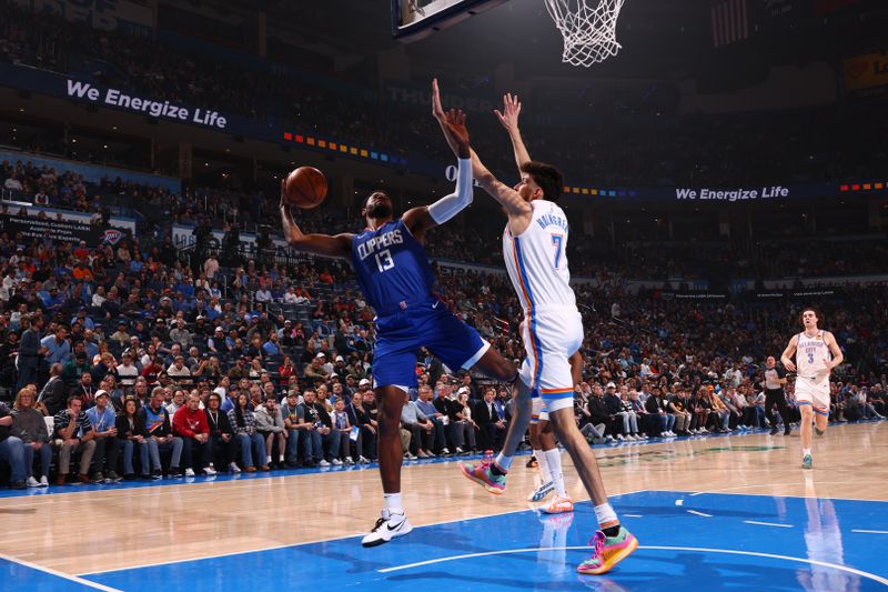 OKLAHOMA CITY, OK - FEBRUARY 22: Paul George #13 of the LA Clippers drives to the basket during the game against the Oklahoma City Thunder on February 22SF, 2024 at Paycom Arena in Oklahoma City, Oklahoma. NOTE TO USER: User expressly acknowledges and agrees that, by downloading and or using this photograph, User is consenting to the terms and conditions of the Getty Images License Agreement. Mandatory Copyright Notice: Copyright 2024 NBAE (Photo by Zach Beeker/NBAE via Getty Images)