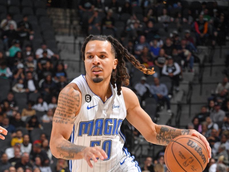 SAN ANTONIO, TX - MARCH 14: Cole Anthony #50 of the Orlando Magic dribbles the ball during the game against the San Antonio Spurs on March 14, 2023 at the AT&T Center in San Antonio, Texas. NOTE TO USER: User expressly acknowledges and agrees that, by downloading and or using this photograph, user is consenting to the terms and conditions of the Getty Images License Agreement. Mandatory Copyright Notice: Copyright 2023 NBAE (Photos by Michael Gonzales/NBAE via Getty Images)