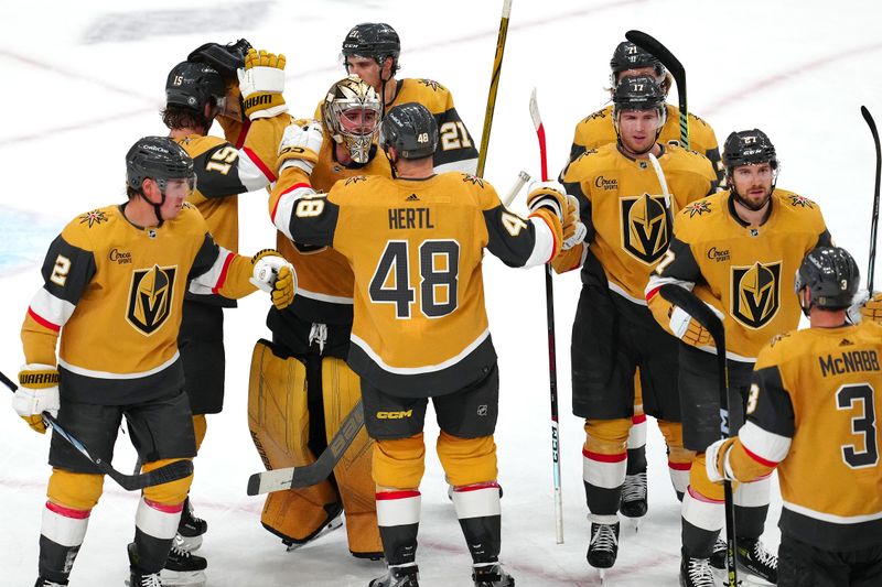 Apr 12, 2024; Las Vegas, Nevada, USA; Vegas Golden Knights players celebrate after defeating the Minnesota Wild 7-2 to clench the final playoff position in the Western Conference at T-Mobile Arena. Mandatory Credit: Stephen R. Sylvanie-USA TODAY Sports