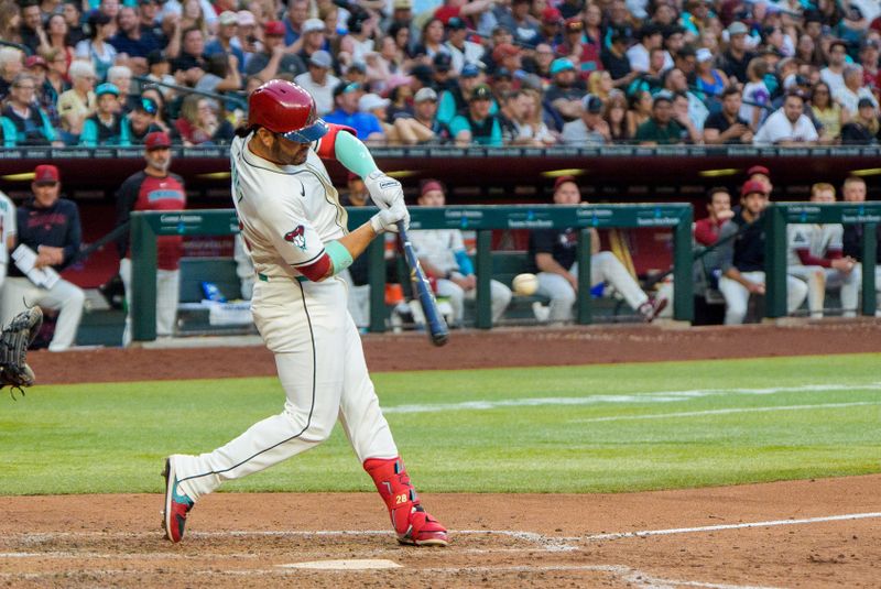 Apr 26, 2025; Phoenix, Arizona, USA;  Arizona Diamondbacks infielder Geraldo Perdomo (2) hits his third home run of the game in the seventh inning against the Atlanta Braves at Chase Field. Mandatory Credit: Allan Henry-Imagn Images