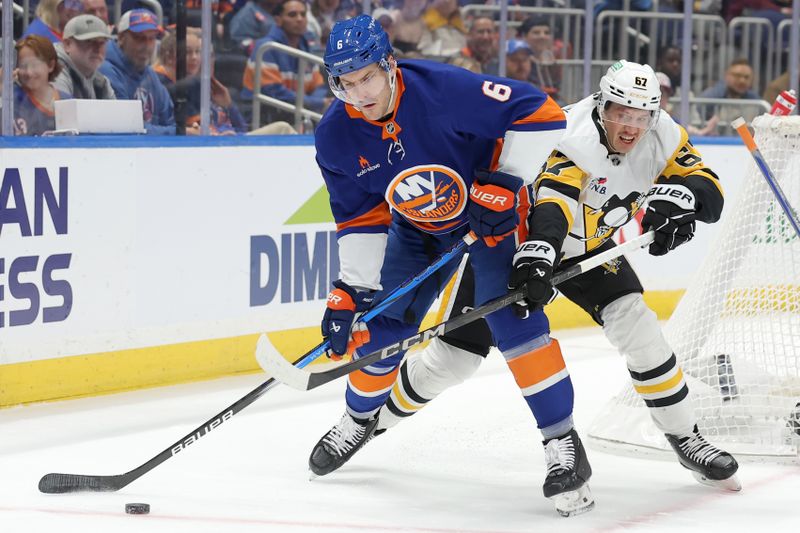 Nov 5, 2024; Elmont, New York, USA; New York Islanders defenseman Ryan Pulock (6) and Pittsburgh Penguins center Sidney Crosby (87) fight for the puck during the first period at UBS Arena. Mandatory Credit: Brad Penner-Imagn Images