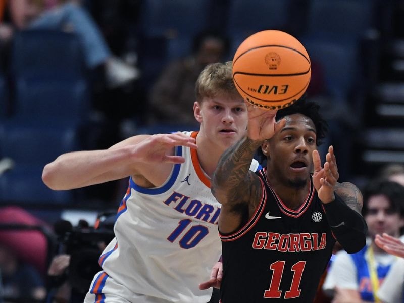 Mar 14, 2024; Nashville, TN, USA; Georgia Bulldogs guard Justin Hill (11) passes the ball as he is pressured by Florida Gators forward Thomas Haugh (10) during the first half at Bridgestone Arena. Mandatory Credit: Christopher Hanewinckel-USA TODAY Sports