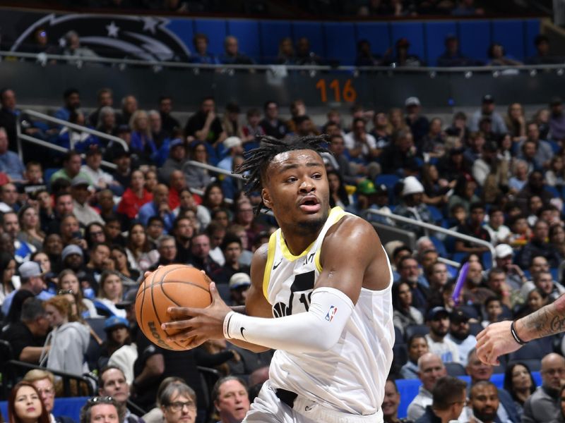 ORLANDO, FL - JANUARY 5 :  Isaiah Collier #13 of the Utah Jazz dribbles the ball during the game against the Orlando Magic on January 5, 2025 at Kia Center in Orlando, Florida. NOTE TO USER: User expressly acknowledges and agrees that, by downloading and or using this photograph, User is consenting to the terms and conditions of the Getty Images License Agreement. Mandatory Copyright Notice: Copyright 2025 NBAE (Photo by Fernando Medina/NBAE via Getty Images)