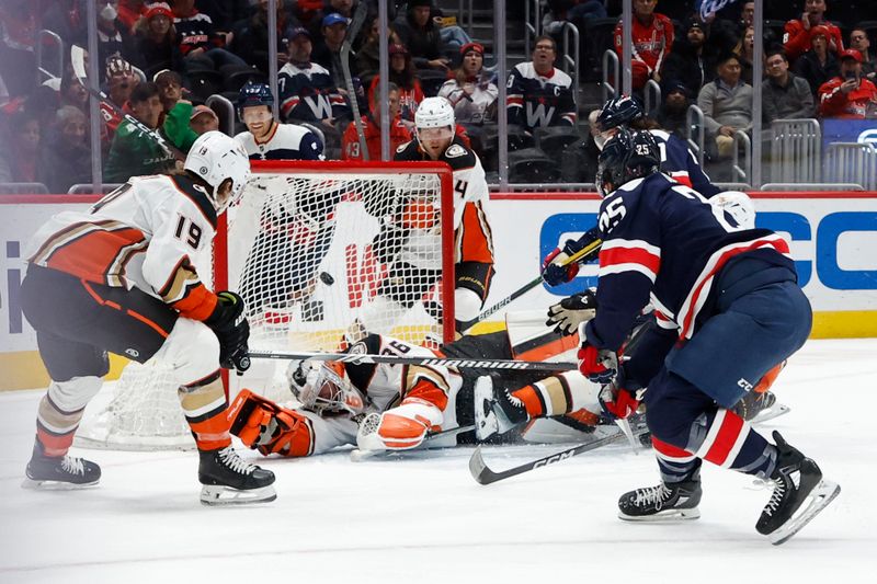 Jan 16, 2024; Washington, District of Columbia, USA; Washington Capitals defenseman Ethan Bear (25) scores a goal on Anaheim Ducks goaltender John Gibson (36) in the first period at Capital One Arena. Mandatory Credit: Geoff Burke-USA TODAY Sports