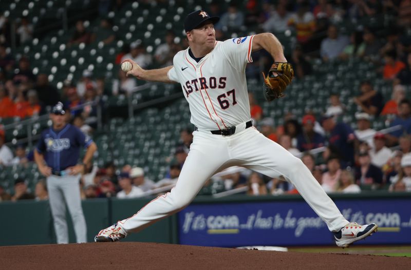 May 29, 2025; Houston, Texas, USA; Houston Astros starting pitcher Ryan Gusto (67) pitches against the Tampa Bay Rays in the first inning at Daikin Park. Mandatory Credit: Thomas Shea-Imagn Images