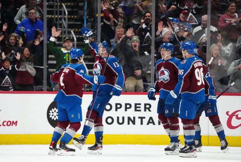 Dec 13, 2023; Denver, Colorado, USA; Colorado Avalanche right wing Valeri Nichushkin (13) (center) celebrates his goal in the first period against the Buffalo Sabres at Ball Arena. Mandatory Credit: Ron Chenoy-USA TODAY Sports