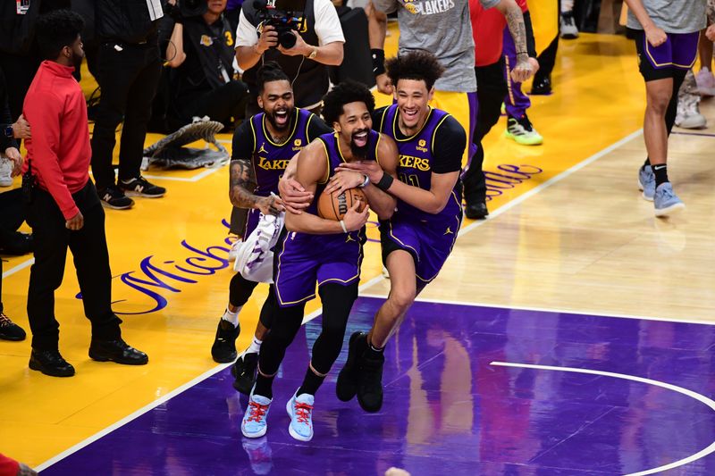 LOS ANGELES, CA - MARCH 8: The Los Angeles Lakers celebrate Spencer Dinwiddie's game-winning block against Damian Lillard #0 of the Milwaukee Bucks on March 8, 2024 at Crypto.Com Arena in Los Angeles, California. NOTE TO USER: User expressly acknowledges and agrees that, by downloading and/or using this Photograph, user is consenting to the terms and conditions of the Getty Images License Agreement. Mandatory Copyright Notice: Copyright 2024 NBAE (Photo by Adam Pantozzi/NBAE via Getty Images)