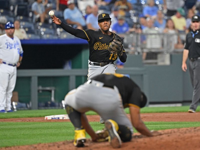 Aug 28, 2023; Kansas City, Missouri, USA;  Pittsburgh Pirates third baseman Ke'Bryan Hayes (13) throws the ball to first base for an out in the seventh inning against the Kansas City Royals at Kauffman Stadium. Mandatory Credit: Peter Aiken-USA TODAY Sports