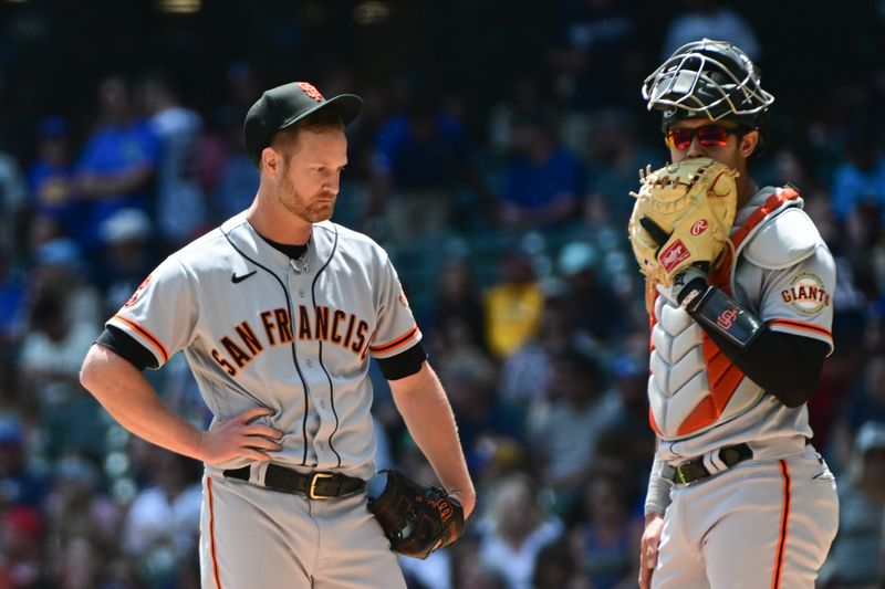 May 28, 2023; Milwaukee, Wisconsin, USA; San Francisco Giants pitcher Alex Cobb (38) talks to San Francisco Giants catcher Blake Sabol (2) in the second inning against the Milwaukee Brewers at American Family Field. Mandatory Credit: Benny Sieu-USA TODAY Sports