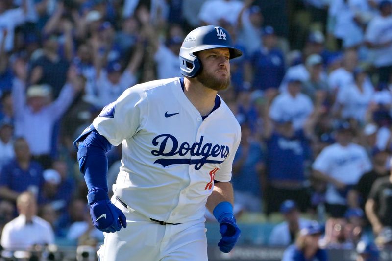 Oct 14, 2024; Los Angeles, California, USA;  Los Angeles Dodgers third baseman Max Muncy (13) runs after hitting a solo home run against the New York Mets in the fifth inning during game two of the NLCS for the 2024 MLB Playoffs at Dodger Stadium. Mandatory Credit: Jayne Kamin-Oncea-Imagn Images