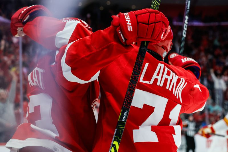 Oct 22, 2023; Detroit, Michigan, USA;  Detroit Red Wings right wing Alex DeBrincat (93) celebrates with center Dylan Larkin (71) after scoring in the second period against the Calgary Flames at Little Caesars Arena. Mandatory Credit: Rick Osentoski-USA TODAY Sports