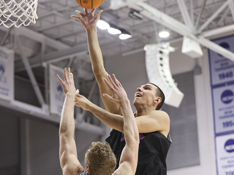 Jan 24, 2024; Houston, Texas, USA; Florida Atlantic Owls center Vladislav Goldin (50) shoots the ball over Rice Owls forward Max Fiedler (15) during the first half at Tudor Fieldhouse. Mandatory Credit: Troy Taormina-USA TODAY Sports