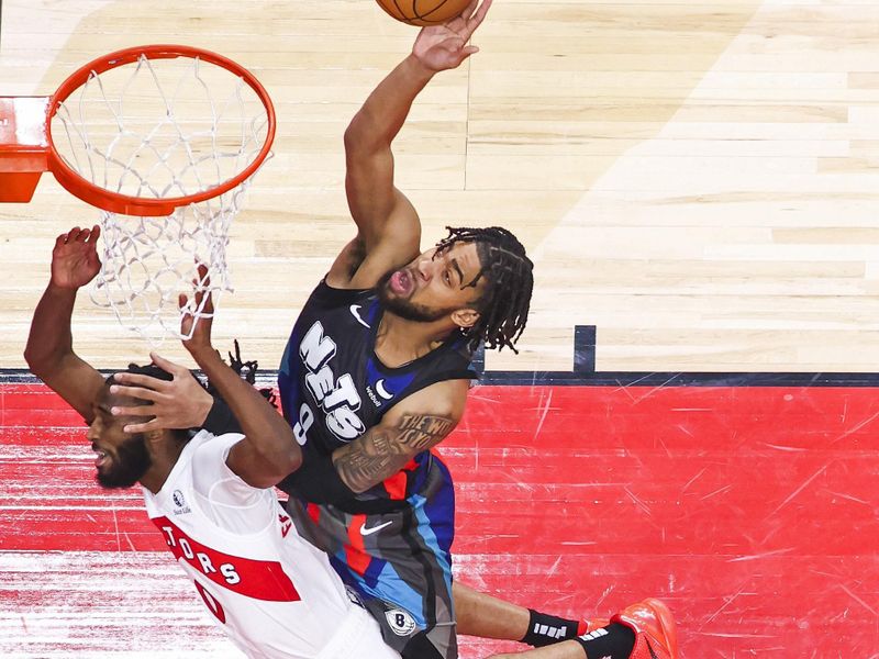 TORONTO, CANADA - MARCH 25: Trendon Watford #9 of the Brooklyn Nets drives to the basket during the game against the Toronto Raptors on March 25, 2024 at the Scotiabank Arena in Toronto, Ontario, Canada.  NOTE TO USER: User expressly acknowledges and agrees that, by downloading and or using this Photograph, user is consenting to the terms and conditions of the Getty Images License Agreement.  Mandatory Copyright Notice: Copyright 2024 NBAE (Photo by Vaughn Ridley/NBAE via Getty Images)