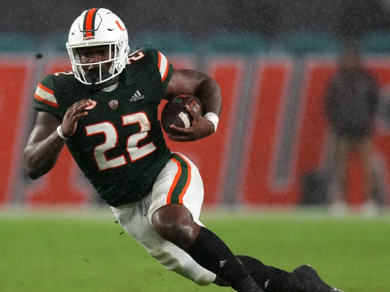 Nov 20, 2021; Miami Gardens, Florida, USA; Miami Hurricanes running back Thaddius Franklin Jr. (22) carries the ball against the Virginia Tech Hokies during the second half at Hard Rock Stadium. Mandatory Credit: Jasen Vinlove-USA TODAY Sports