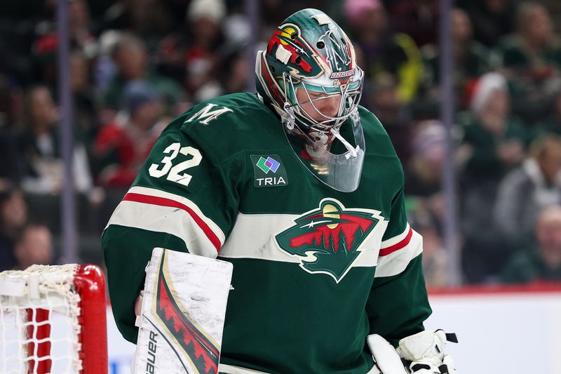 Dec 3, 2024; Saint Paul, Minnesota, USA; Minnesota Wild goaltender Filip Gustavsson (32) reacts to Vancouver Canucks defenseman Quinn Hughes's (43) goal during the first period at Xcel Energy Center. Mandatory Credit: Matt Krohn-Imagn Images