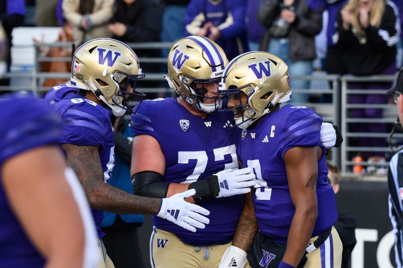 Nov 11, 2023; Seattle, Washington, USA; Washington Huskies tight end Devin Culp (83) and offensive lineman Roger Rosengarten (73) and quarterback Michael Penix Jr. (9) celebrate after Penix ran the ball in for a touchdown against the Utah Utes during the first half at Alaska Airlines Field at Husky Stadium. Mandatory Credit: Steven Bisig-USA TODAY Sports