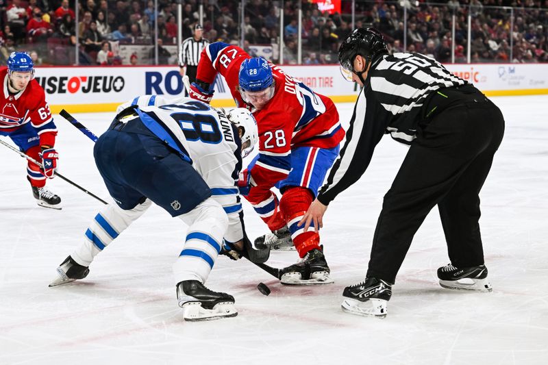 Jan 17, 2023; Montreal, Quebec, CAN; NHL linesman Scott Cherrey (50) drops the puck at face-off between Winnipeg Jets center Kevin Stenlund (28) and Montreal Canadiens center Christian Dvorak (28) during the second period at Bell Centre. Mandatory Credit: David Kirouac-USA TODAY Sports