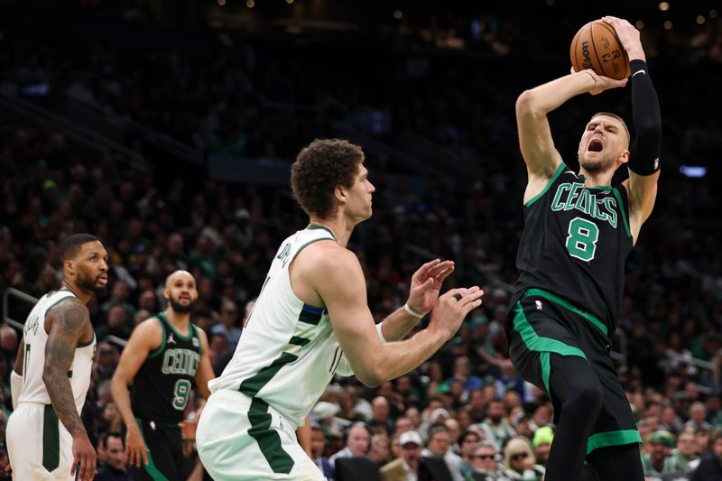 BOSTON, MA - MARCH 20:  Kristaps Porzingis #8 of the Boston Celtics shoots over Brook Lopez #11 of the Milwaukee Bucks in the third quarter at TD Garden on March 20, 2024 in Boston, Massachusetts. NOTE TO USER: User expressly acknowledges and agrees that, by downloading and or using this photograph, User is consenting to the terms and conditions of the Getty Images License Agreement. (Photo by Adam Glanzman/Getty Images)