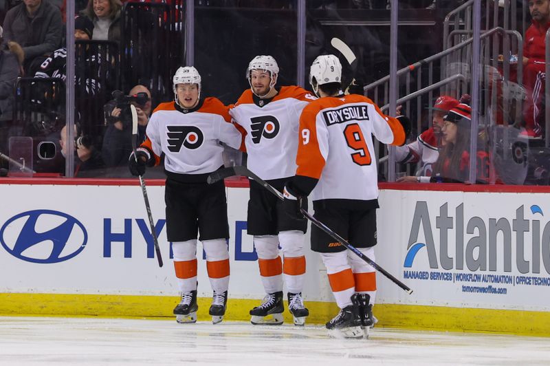 Jan 18, 2025; Newark, New Jersey, USA; Philadelphia Flyers right wing Matvei Michkov (39) celebrates his goal against the New Jersey Devils during the second period at Prudential Center. Mandatory Credit: Ed Mulholland-Imagn Images