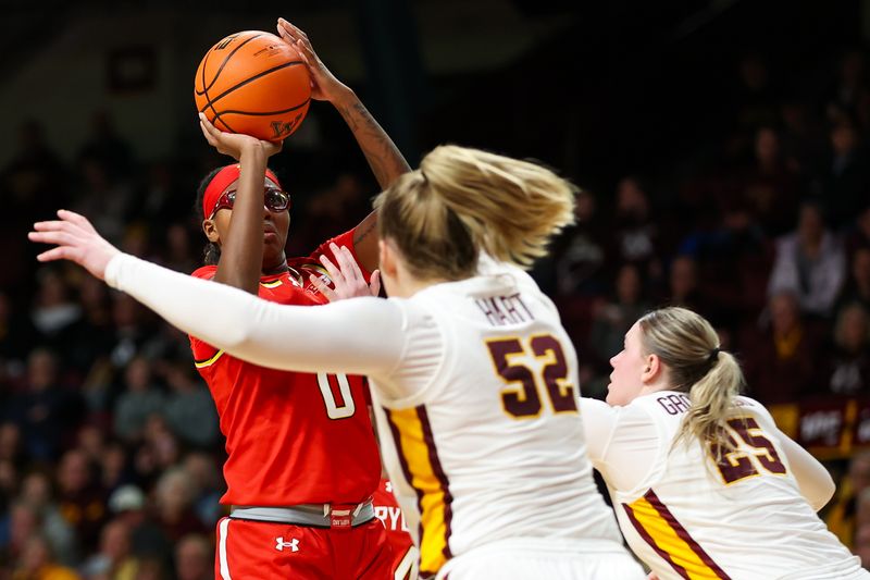 Jan 3, 2024; Minneapolis, Minnesota, USA; Maryland Terrapins guard Shyanne Sellers (0) shoots as Minnesota Golden Gophers center Sophie Hart (52) and guard Grace Grocholski (25) defend during the second half at Williams Arena. Mandatory Credit: Matt Krohn-USA TODAY Sports