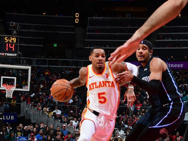 ATLANTA, GA - JANUARY 17: Dejounte Murray #5 of the Atlanta Hawks goes to the basket during the game on January 17, 2024 at State Farm Arena in Atlanta, Georgia.  NOTE TO USER: User expressly acknowledges and agrees that, by downloading and/or using this Photograph, user is consenting to the terms and conditions of the Getty Images License Agreement. Mandatory Copyright Notice: Copyright 2024 NBAE (Photo by Scott Cunningham/NBAE via Getty Images)