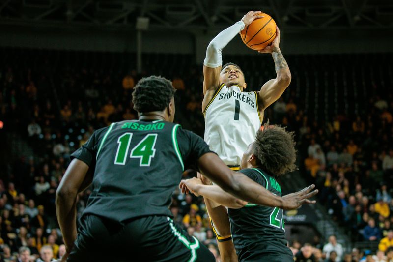 Jan 4, 2024; Wichita, Kansas, USA; Wichita State Shockers guard Xavier Bell (1) puts up a shot during the first half against the North Texas Mean Green at Charles Koch Arena. Mandatory Credit: William Purnell-USA TODAY Sports