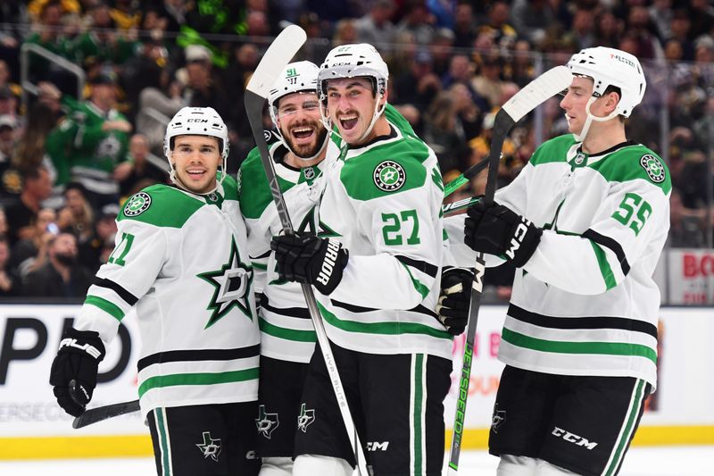 Oct 24, 2024; Boston, Massachusetts, USA;  Dallas Stars center Tyler Seguin (91) reacts with center Logan Stankoven (11) left wing Mason Marchment (27) and defenseman Thomas Harley (55) after scoring a goal during the second period against the Boston Bruins at TD Garden. Mandatory Credit: Bob DeChiara-Imagn Images