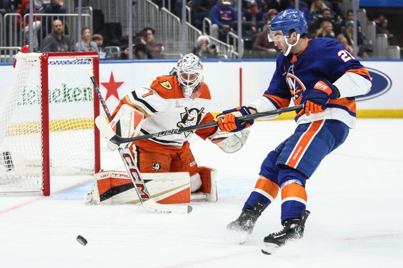 Oct 29, 2024; Elmont, New York, USA;  Anaheim Ducks goaltender Lukas Dostal (1) defends against a shot on goal attempt by New York Islanders center Kyle Palmieri (21) in the second period at UBS Arena. Mandatory Credit: Wendell Cruz-Imagn Images