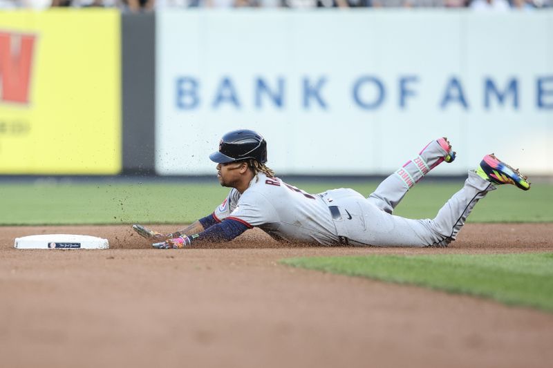 Jun 4, 2025; Bronx, New York, USA;  Cleveland Guardians third baseman José Ramirez (11) slides into second base after hitting a double in the first inning against the New York Yankees at Yankee Stadium. Mandatory Credit: Wendell Cruz-Imagn Images