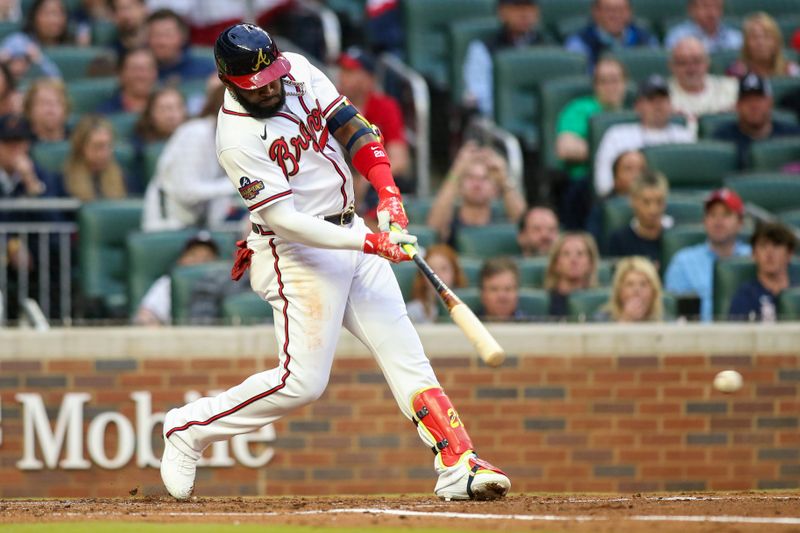 Apr 11, 2022; Atlanta, Georgia, USA; Atlanta Braves left fielder Marcell Ozuna (20) hits an RBI single against the Washington Nationals in the first inning at Truist Park. Mandatory Credit: Brett Davis-USA TODAY Sports