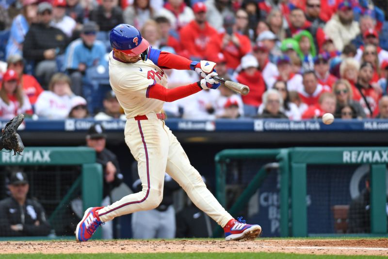 Apr 21, 2024; Philadelphia, Pennsylvania, USA; Philadelphia Phillies shortstop Trea Turner (7) hits an RBI single against the Chicago White Sox during the fourth inning at Citizens Bank Park. Mandatory Credit: Eric Hartline-USA TODAY Sports