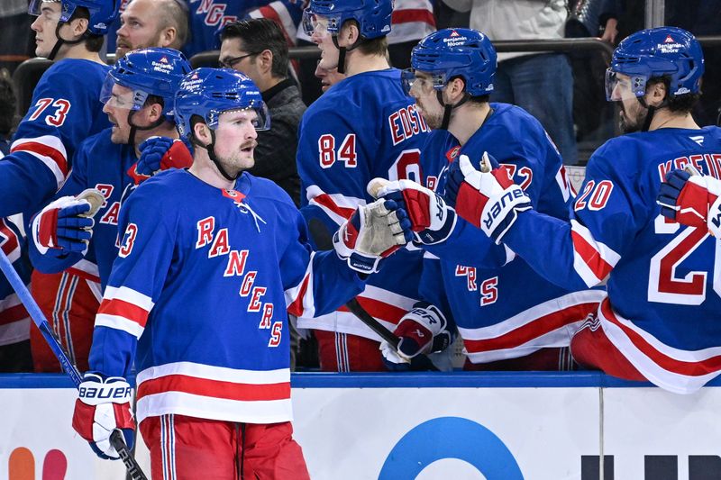 Jan 21, 2025; New York, New York, USA;  New York Rangers left wing Alexis Lafrenière (13) celebrates his goal against the Ottawa Senators during the first period at Madison Square Garden. Mandatory Credit: Dennis Schneidler-Imagn Images