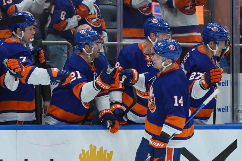 Apr 2, 2024; Elmont, New York, USA; New York Islanders center Bo Horvat (14) celebrates his goal against the Chicago Blackhawks during the third period at UBS Arena. Mandatory Credit: Thomas Salus-USA TODAY Sports